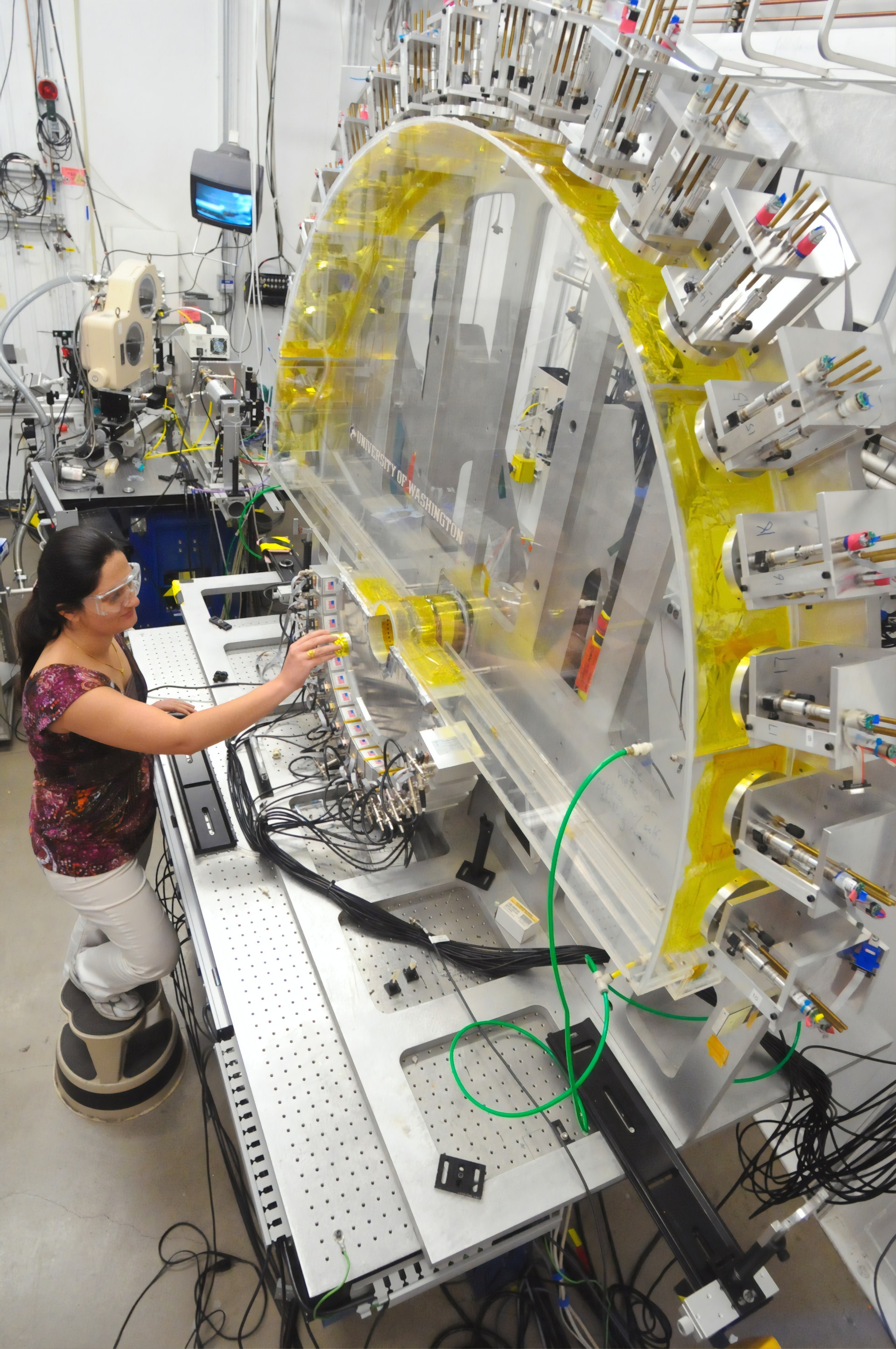 Argonne National Laboratory assistance materials scientist loads an in-situ-lithium-ion battery into the Low-Energy Resolution Inelastic X-ray (LERIX) system at the Advanced Photon Source(APS).